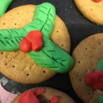 We used some coloured icing to make these lovely holly biscuits