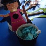 witch puppet and her cauldron