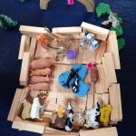 some other children made this farm using the wooden bricks and the animals